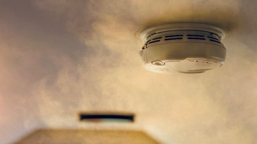 Smoke detector installed onto ceiling.